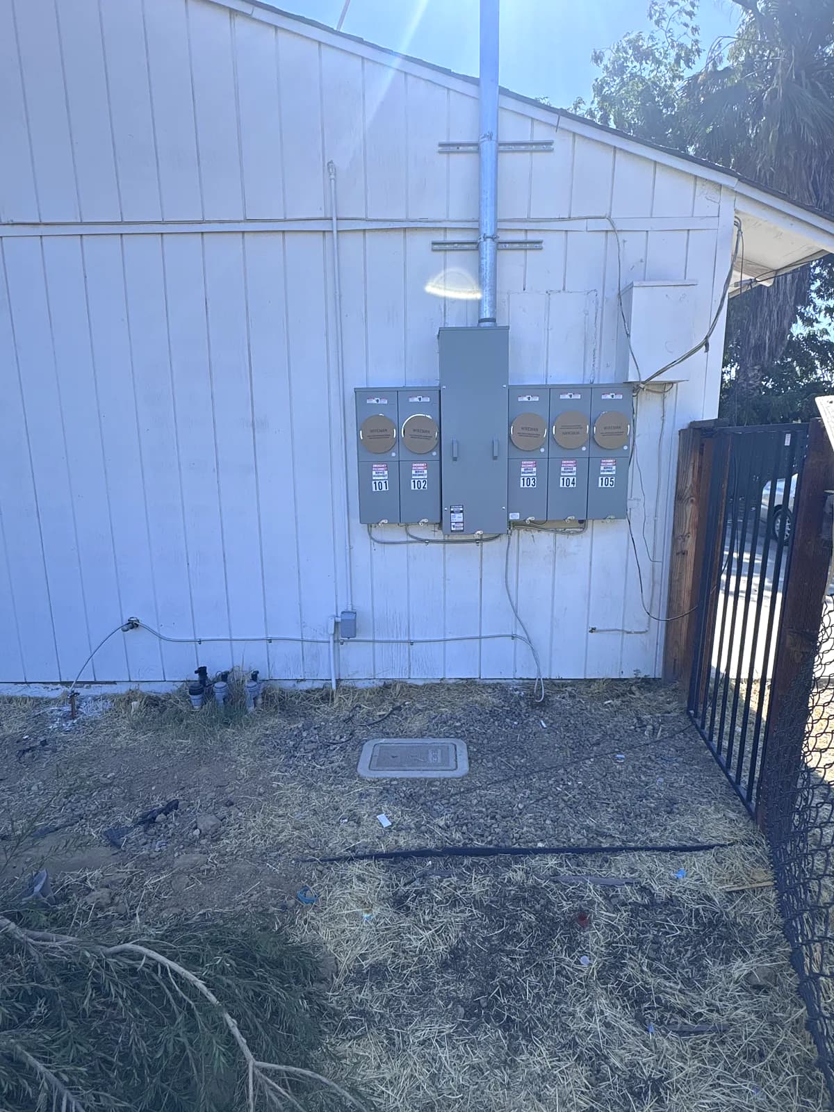 A new 400 amp main panel with a five-meter bank on an exterior wall