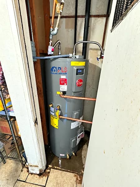 A newly installed water heater with new piping in a utility closet