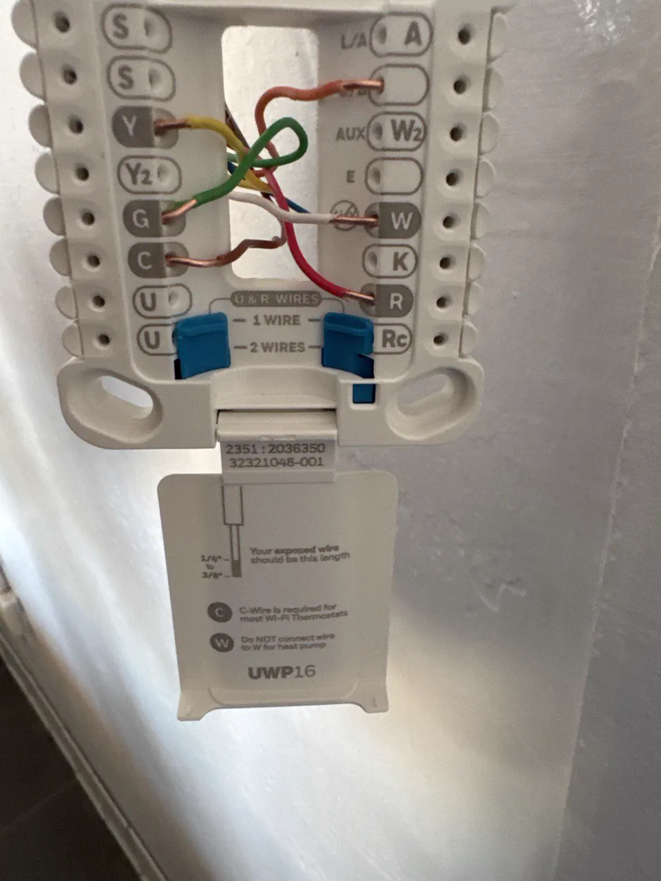 Thermostat wiring terminals labeled for heating and cooling