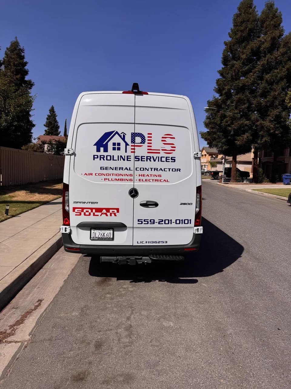 Rear of the ProLine Services van showing the logo and phone number
